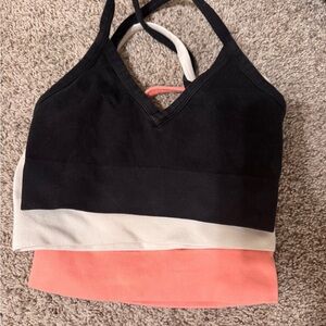 Black, White, and Coral alo sports bras